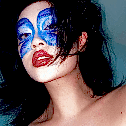 Funky Nutmeg with a blue butterfly painted on her face